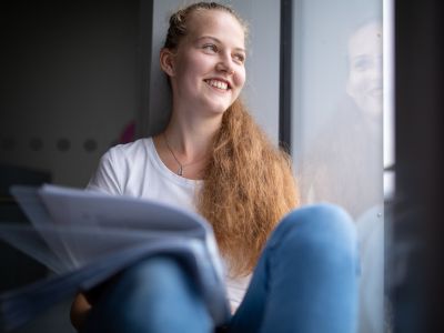 Student sitting by a window