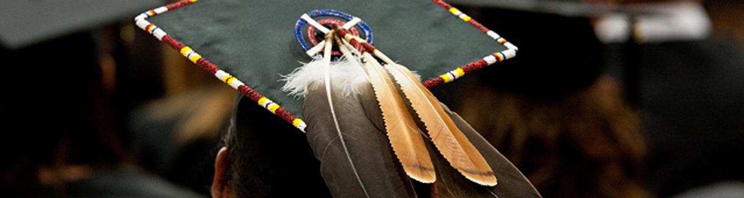mortar board with native american feathers